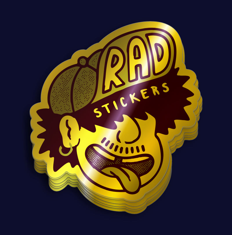 Stack of custom metalic gold stickers with 'Rad Stickers' text on a dark blue background
