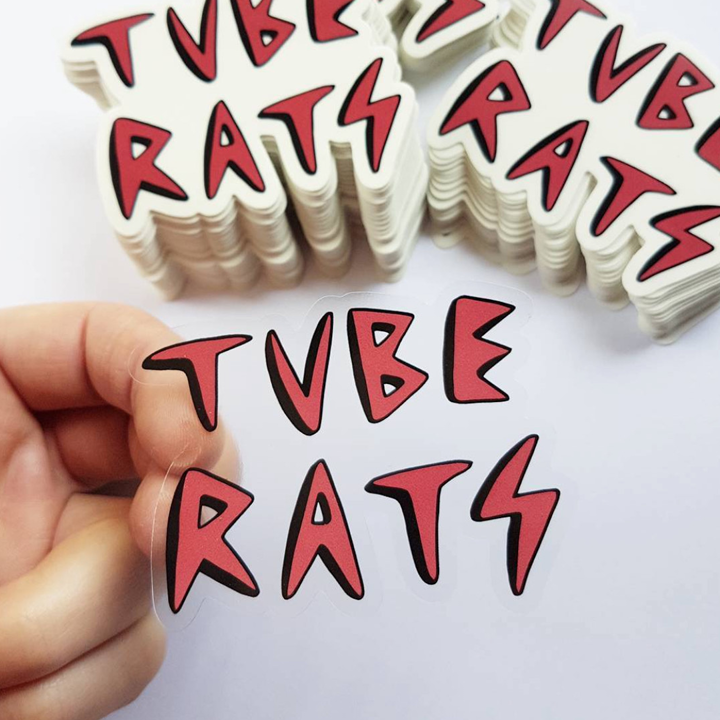 'TUBE RATS' stickers with a hand holding one.