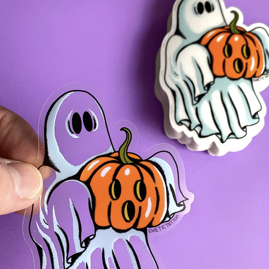 Halloween-themed stickers of ghosts with pumpkins on a purple background
