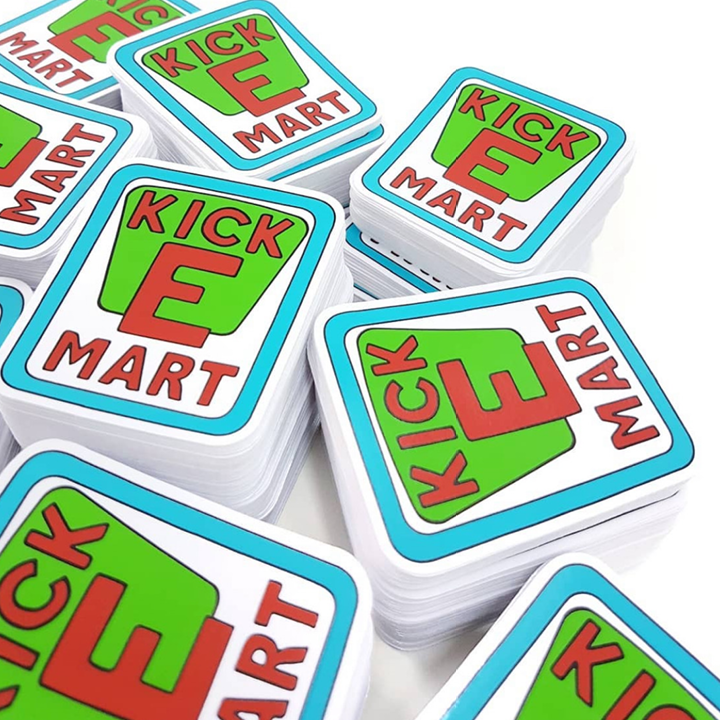 Stack of 'KICK E MART' branded stickers on a white background