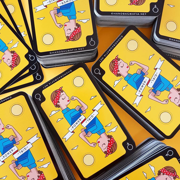 Set of tarot cards with illustrated characters on a yellow background