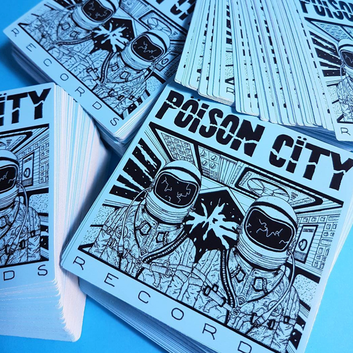 Stickers with 'Poison City' design on a blue background